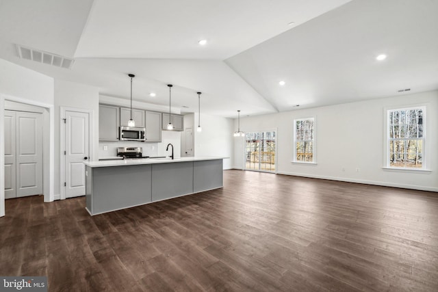 kitchen with visible vents, appliances with stainless steel finishes, gray cabinets, light countertops, and a sink