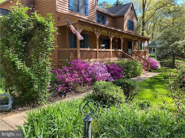 view of side of home featuring a porch