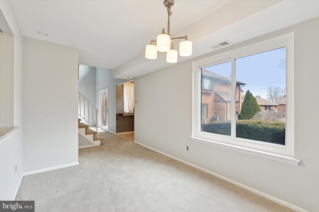 carpeted spare room with stairs, a chandelier, visible vents, and baseboards