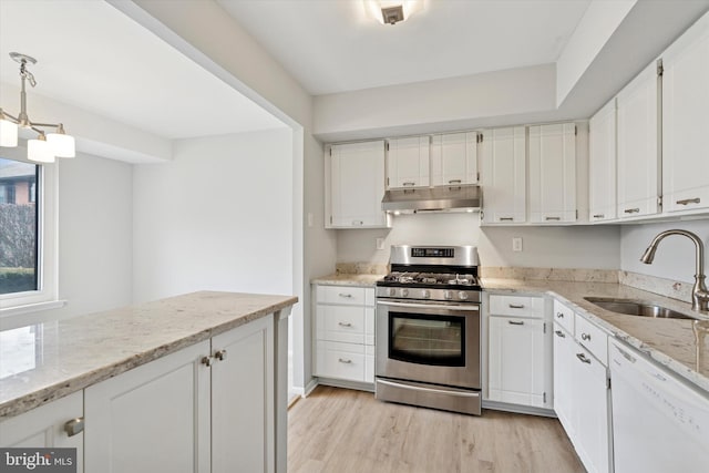 kitchen with light wood-style flooring, a sink, stainless steel gas range, dishwasher, and under cabinet range hood