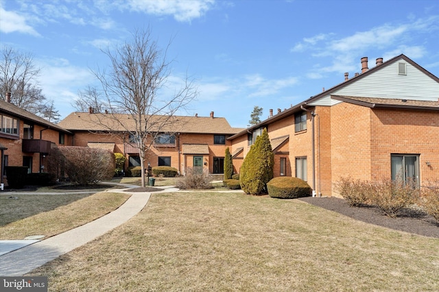 view of community with a residential view and a lawn