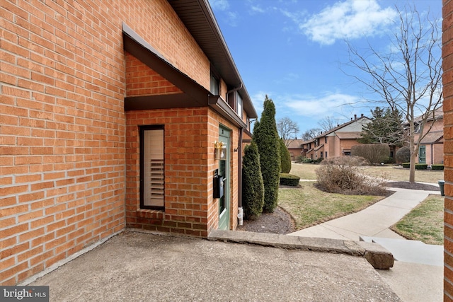 view of home's exterior with brick siding