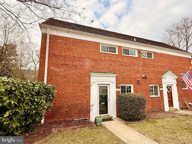 view of front of home featuring brick siding