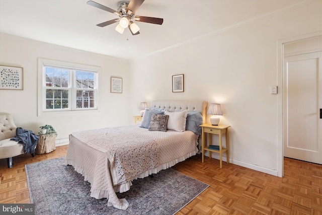 bedroom featuring ceiling fan, ornamental molding, and baseboards