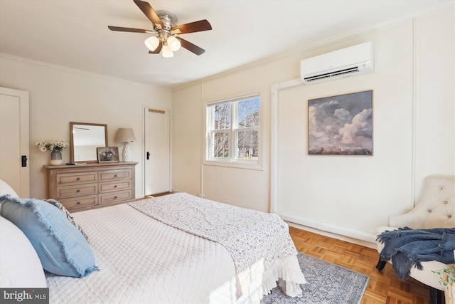 bedroom featuring ceiling fan, ornamental molding, and a wall mounted air conditioner