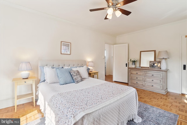 bedroom featuring ornamental molding, a ceiling fan, and baseboards