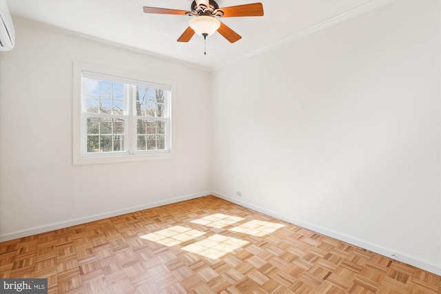 spare room with a ceiling fan, baseboards, crown molding, and a wall mounted AC