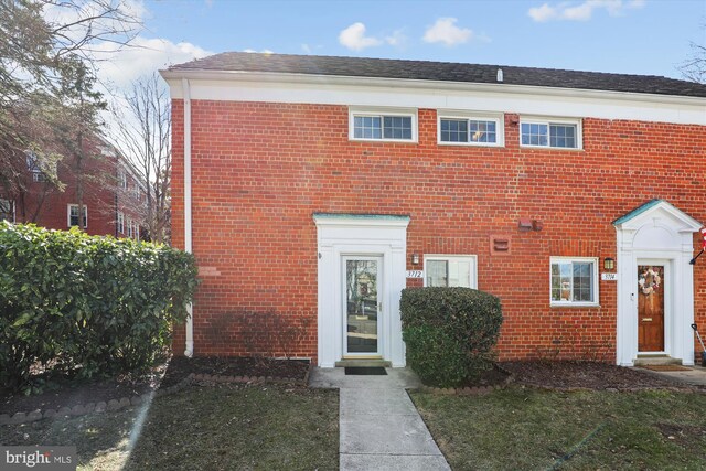 view of front of home featuring brick siding