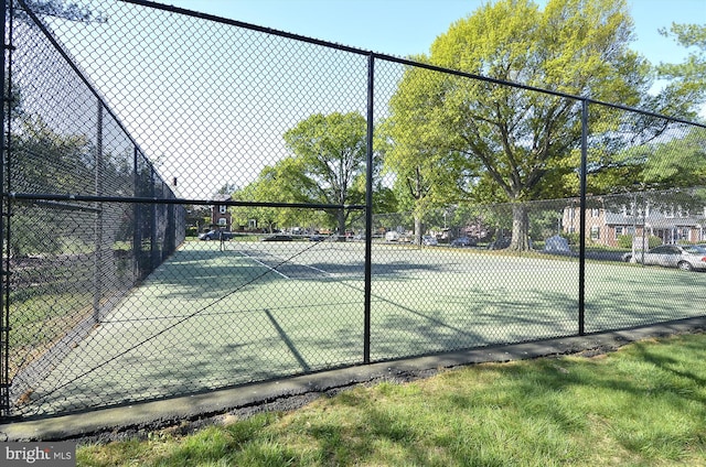 view of sport court with fence