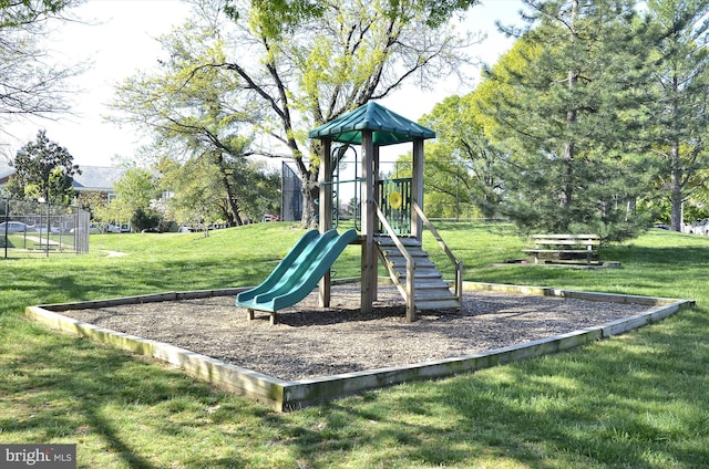 community jungle gym with a lawn