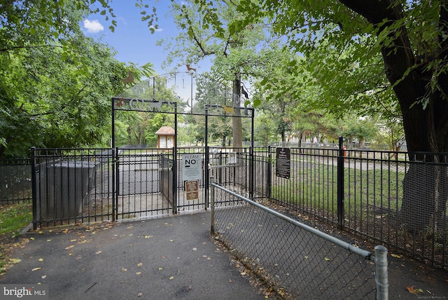 view of gate with fence