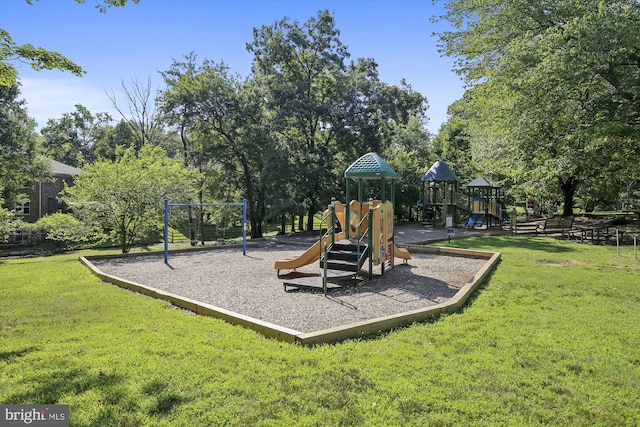 community play area with a lawn