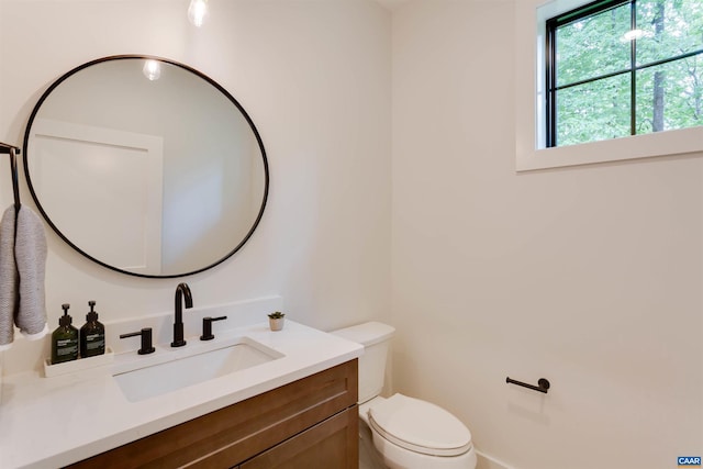 half bath with vanity and toilet