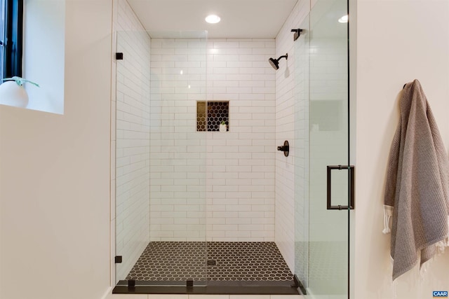 full bathroom with a shower stall and recessed lighting