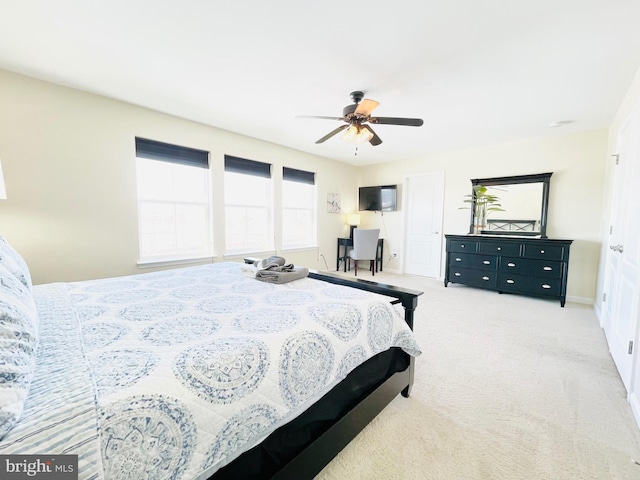 carpeted bedroom featuring a ceiling fan