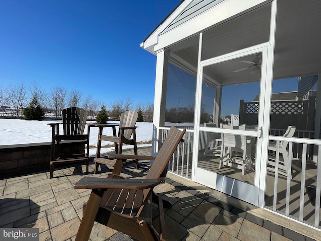 view of patio / terrace with a sunroom