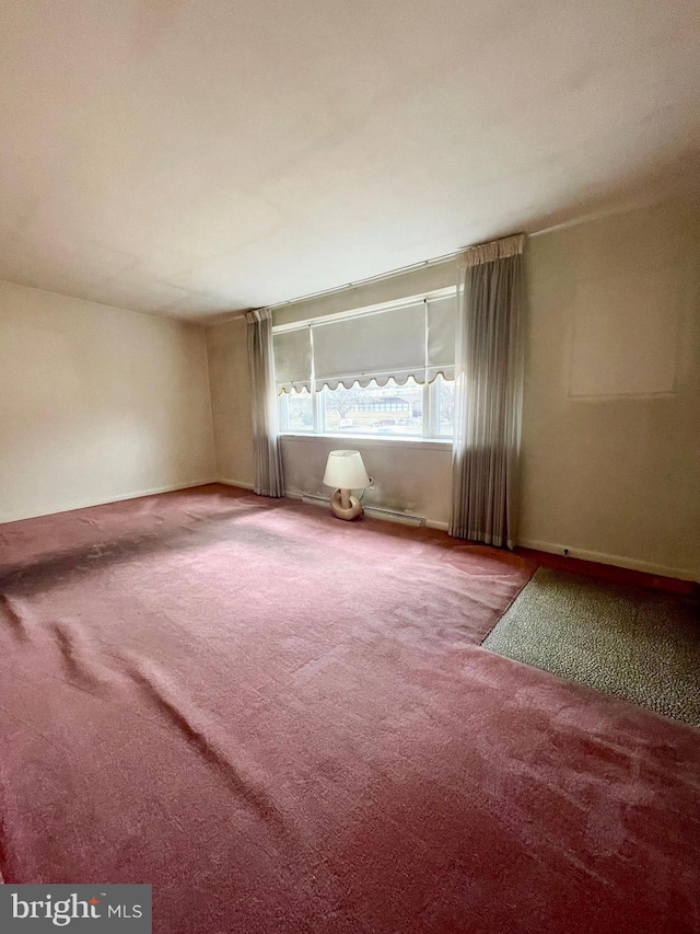 unfurnished room featuring carpet