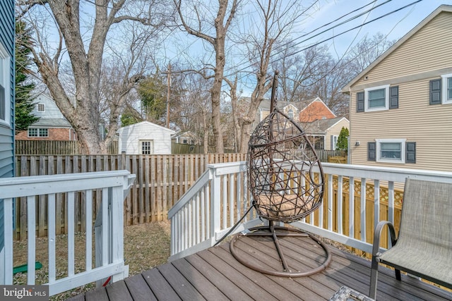 wooden deck with a residential view and fence