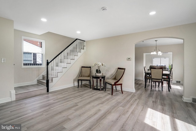 interior space featuring stairs, light wood-type flooring, baseboards, and recessed lighting