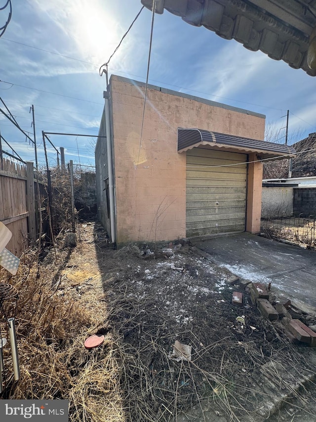 garage featuring fence