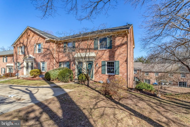 view of front of house featuring brick siding