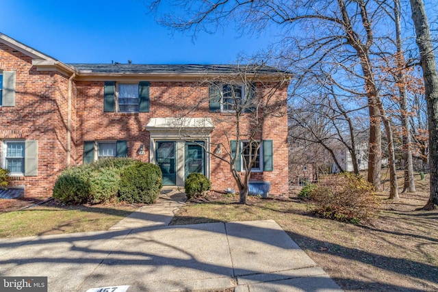 view of front of home featuring brick siding