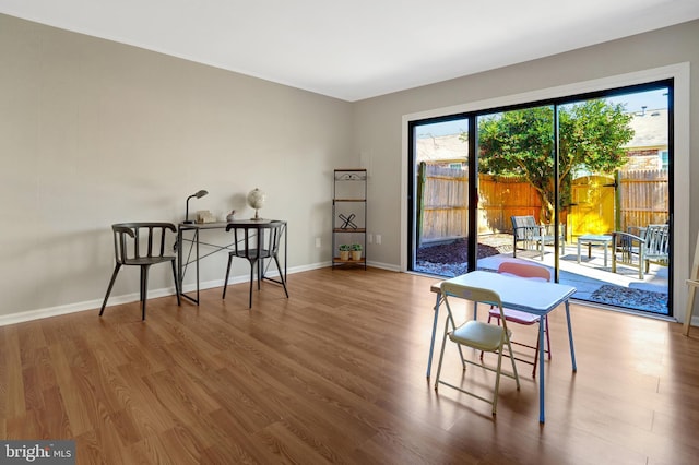 living area featuring wood finished floors and baseboards