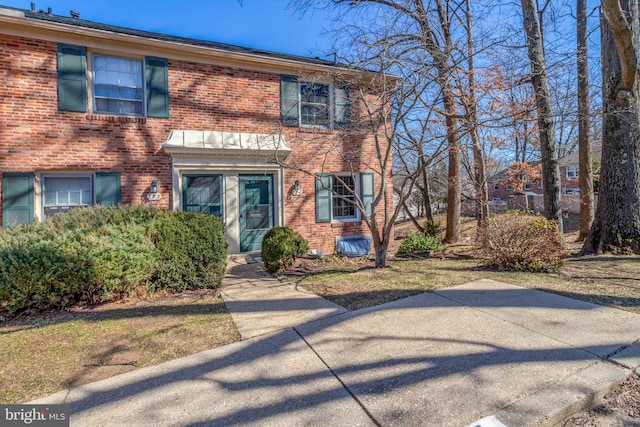 view of front of property featuring brick siding