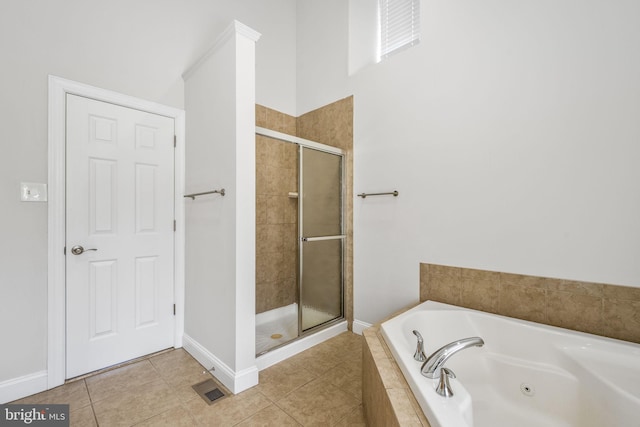 bathroom featuring visible vents, baseboards, a stall shower, a whirlpool tub, and tile patterned floors