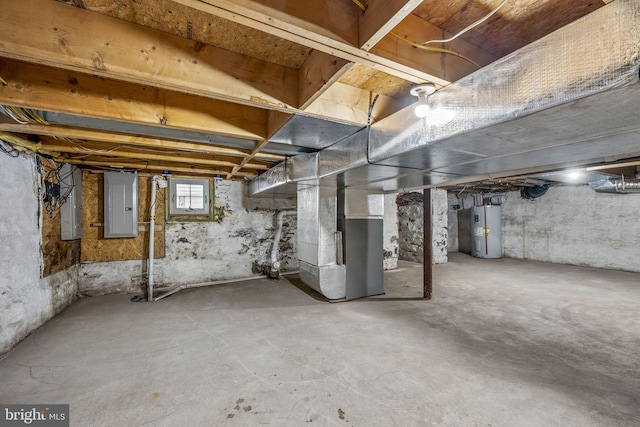 basement with heating unit, electric panel, and electric water heater