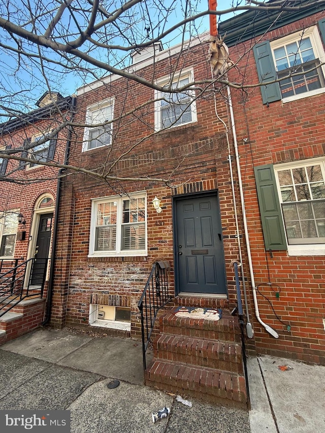 multi unit property featuring brick siding