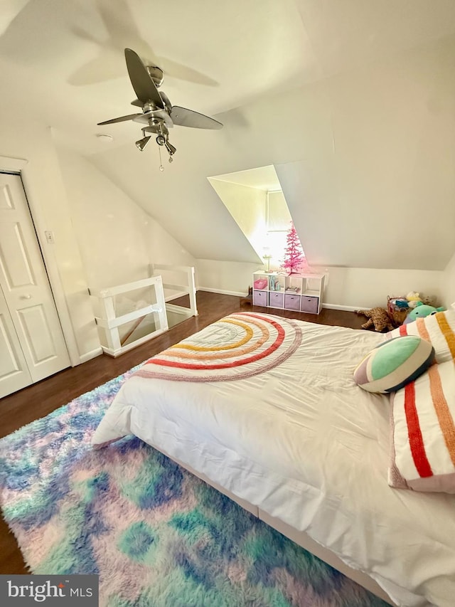 bedroom with lofted ceiling, ceiling fan, and wood finished floors