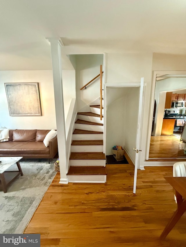 stairs with wood finished floors