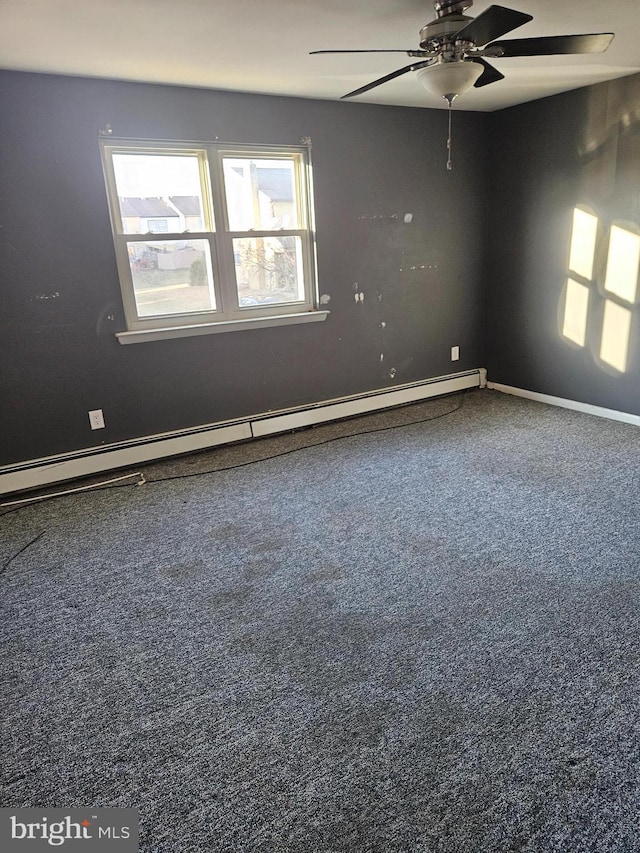 unfurnished room featuring a baseboard heating unit, ceiling fan, and baseboards