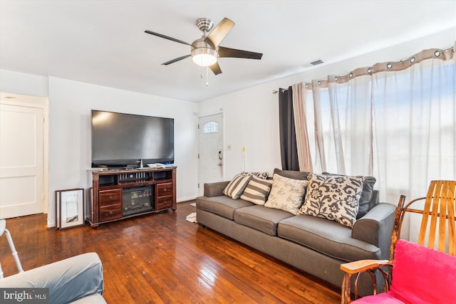 living area with ceiling fan and hardwood / wood-style floors