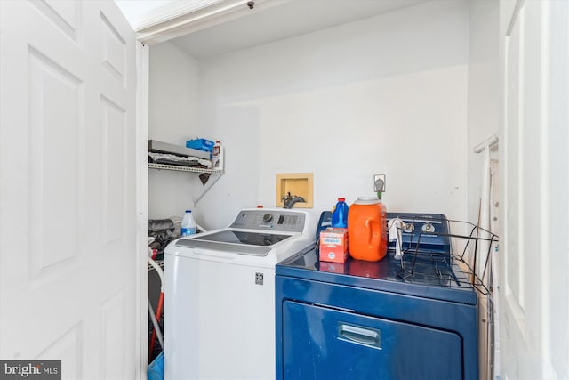 clothes washing area with laundry area and washing machine and clothes dryer