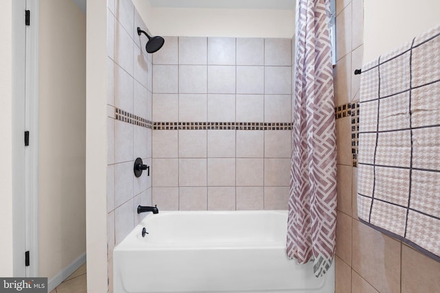 bathroom with shower / bath combination with curtain