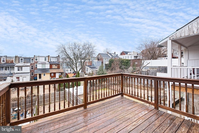 wooden terrace with a residential view