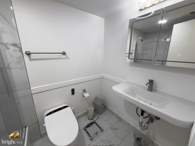 full bath with toilet, marble finish floor, a marble finish shower, and baseboards