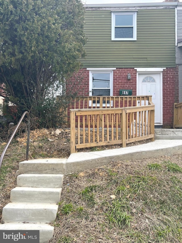 view of front of house featuring brick siding