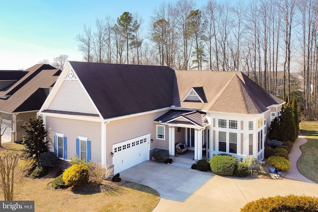 traditional home with driveway and an attached garage