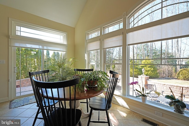 sunroom / solarium with vaulted ceiling and visible vents