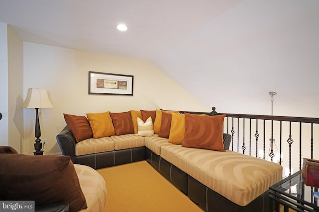 living room featuring vaulted ceiling, carpet, and recessed lighting