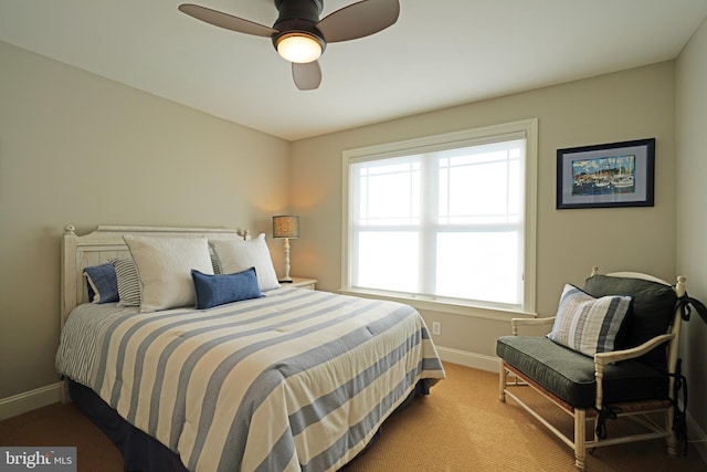 bedroom featuring carpet floors, baseboards, and a ceiling fan