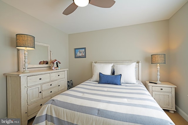 bedroom with carpet floors, baseboards, and a ceiling fan