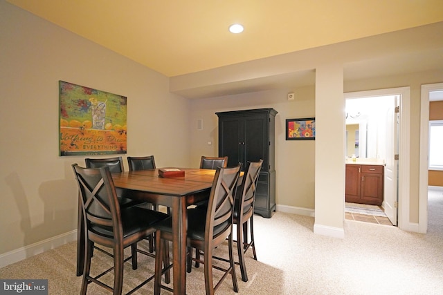 dining space with light carpet, recessed lighting, and baseboards