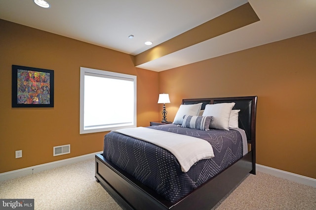 bedroom featuring carpet floors, recessed lighting, visible vents, and baseboards