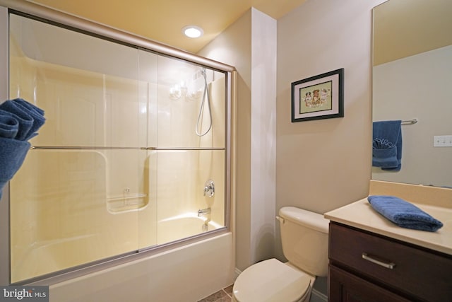 bathroom featuring toilet, recessed lighting, enclosed tub / shower combo, and vanity