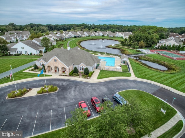 bird's eye view featuring a residential view and a water view