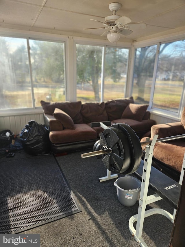 sunroom with a ceiling fan